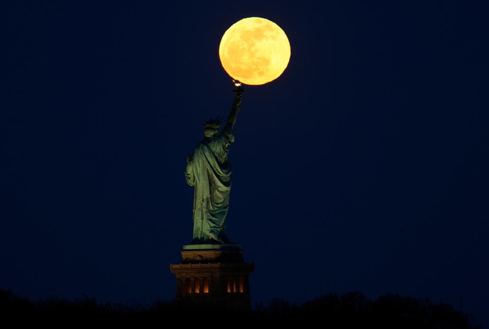 the bright full moon in the night sky