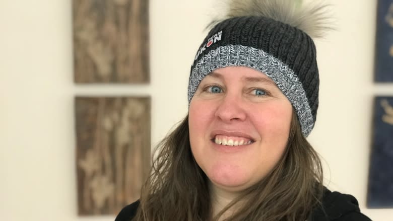 Volunteers make wolf fur pompoms for Yukon's Arctic Winter Games athletes