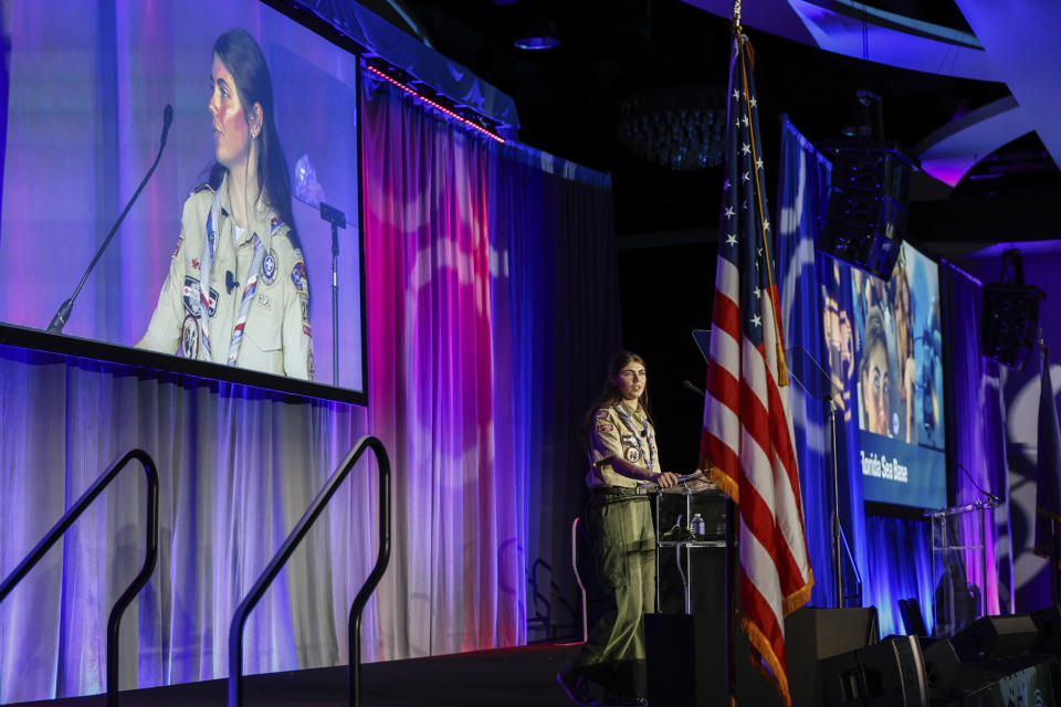 Selby Chipman, 20-year-old, speaks to the Boys Scouts of America annual meeting in Orlando, Fla., Tuesday, May 7, 2024. Chipman, a student at the University of Missouri, is an inaugural female Eagle Scout and the Assistant Scoutmaster for an all girls troop 8219 in Oak Ridge, N.C. The Boy Scouts of America is changing its name for the first time in its 114-year history and will become Scouting America. (AP Photo/Kevin Kolczynski)