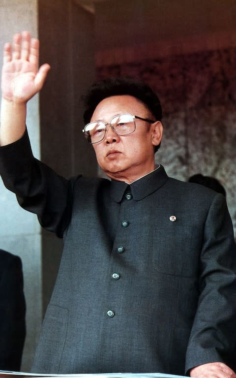 Kim Jong Il waves to Pyongyang residents on October 10, 1995 - Credit:  AP