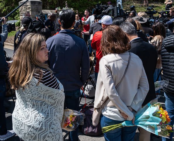 NASHVILLE, TN - MARCH 28: Mourners listen as Chief of Police John Drake delivers a press briefing at the entrance of The Covenant School on March 28, 2023 in Nashville, Tennessee. According to reports, three students and three adults were killed by the 28-year-old shooter on Monday.  (Photo by Seth Herald/Getty Images)