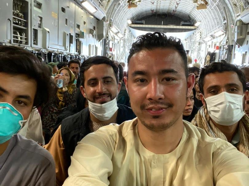 Hamed Ahmadi, front, joins other evacuees from Afghanistan after the Taliban took control back of the country (Hamed Ahmadi)