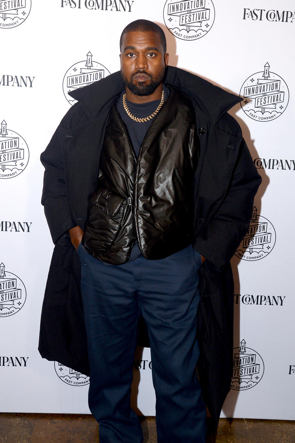 American rapper Kanye West wearing navy blue and black posing for picture at Fast Company Innovation Fest.