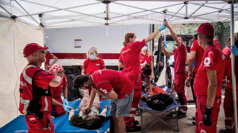 PHOTO: Migrants receive help from Red Cross on the Italian island of Lampedusa, Sept. 14, 2023. (Alessandro Serrano/AFP via Getty Images)