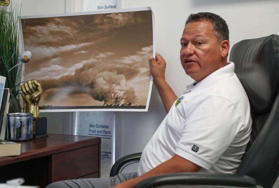 Luis Olmedo talks about a photograph that shows agricultural burning that threatens the air quality in Brawley.