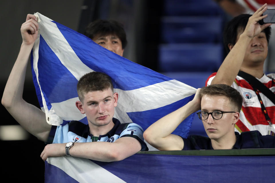 Scotland fans react after the Rugby World Cup Pool A game at International Stadium between Japan and Scotland in Yokohama, Japan, Sunday, Oct. 13, 2019. Japan won 28-21. (AP Photo/Jae Hong)