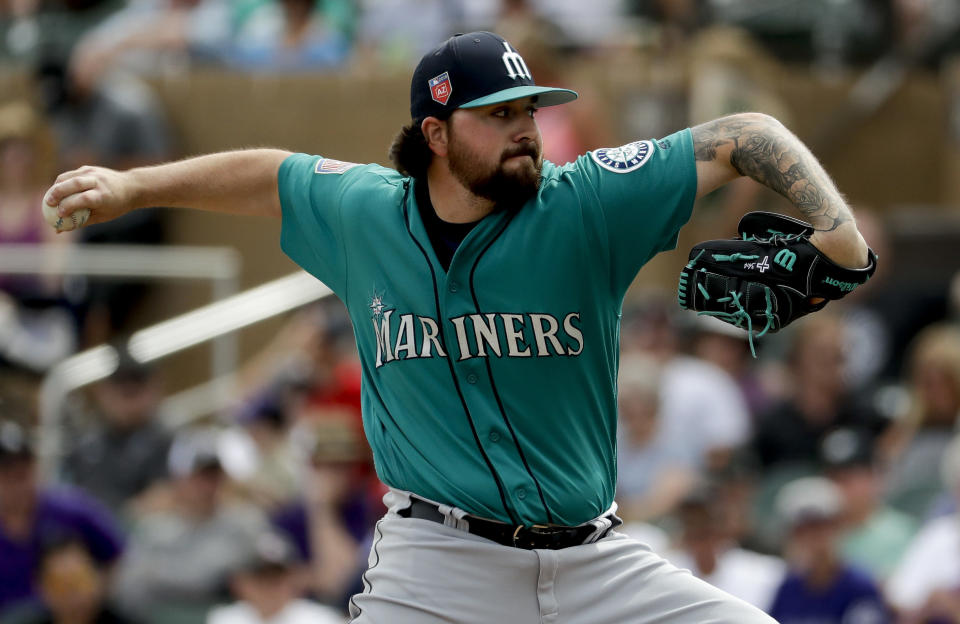 Seattle Mariners relief pitcher Rob Whalen throws against the Colorado Rockies during the first inning of a spring training baseball game in Scottsdale, Ariz., Tuesday, March 13, 2018. (AP Photo/Chris Carlson)