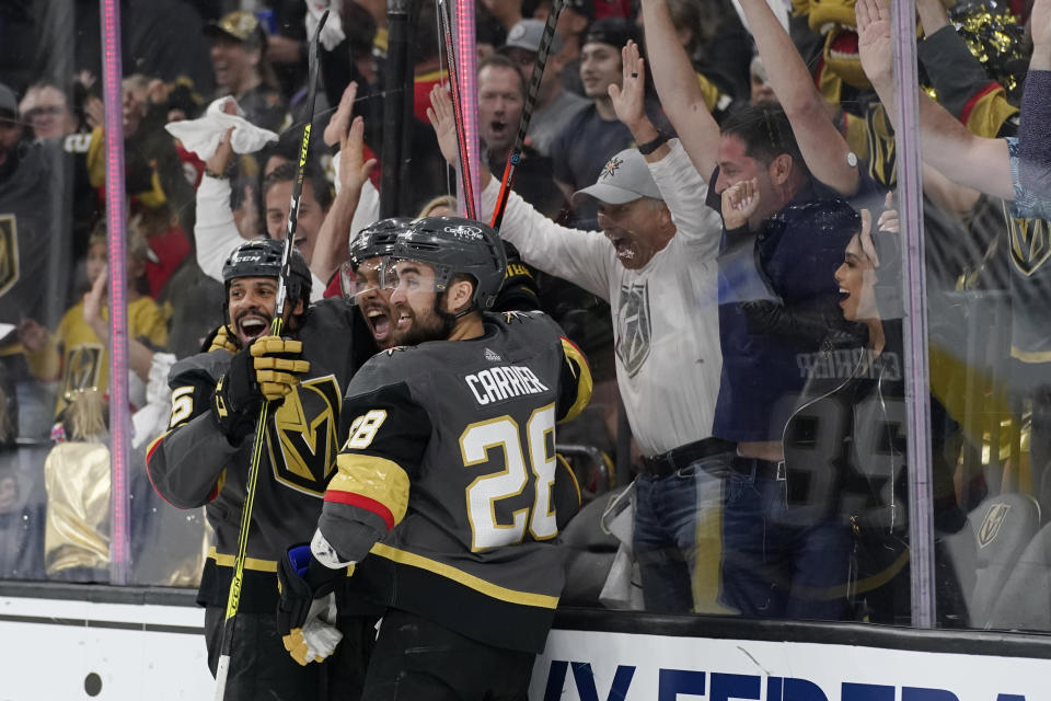 Vegas Golden Knights right wing Keegan Kolesar, center, celebrates after scoring against the Colorado Avalanche during the second period in Game 6 of an NHL hockey Stanley Cup second-round playoff series Thursday, June 10, 2021, in Las Vegas. (AP Photo/John Locher)
