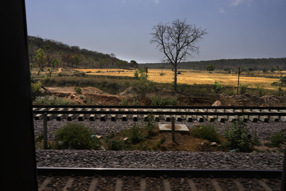 The Thirukkural Express passes through a forest, with new railway lines being laid, in the central Indian state of Madhya Pradesh, Saturday, April 20, 2024. (AP Photo/Manish Swarup)