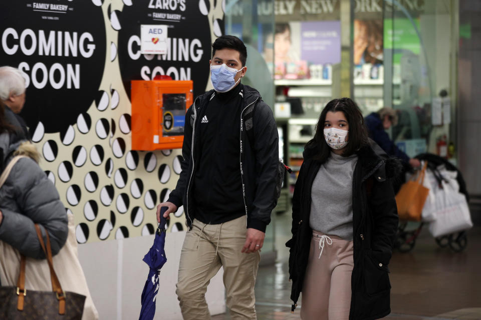 People wear face masks as a precaution against coronavirus in New York, United States.