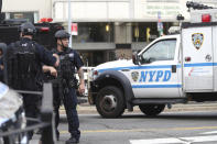 <p>A heavily armed police officer stands outside Bronx Lebanon Hospital after a gunman opened fire and then took his own life there on Friday, June 30, 2017. The gunman, identified as Dr. Henry Bello who used to work at the hospital, returned with a rifle hidden under his white lab coat, law enforcement officials said. (AP Photo/Mary Altaffer) </p>