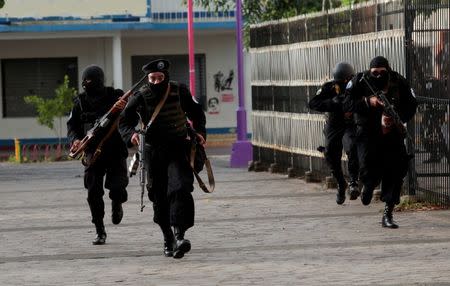 Members of Nicaragua's Special Forces run during clashes with anti-government protesters in the indigenous community of Monimbo in Masaya, July 13. REUTERS/Oswaldo Rivas