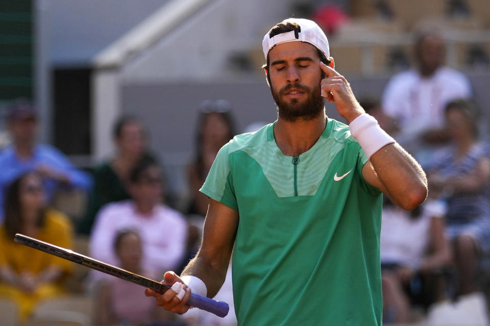 Russia's Karen Khachanov reacts after missing a shot against Serbia's Novak Djokovic during their quarterfinal match of the French Open tennis tournament at the Roland Garros stadium in Paris, Tuesday, June 6, 2023. (AP Photo/Thibault Camus)