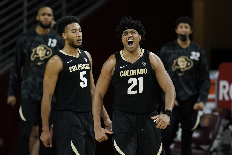 Colorado's Evan Battey celebrates his basket during the second half of the team's NCAA college basketball game against Southern California, Thursday, Dec. 31, 2020, in Los Angeles. Colorado won 72-62. (AP Photo/Jae C. Hong)