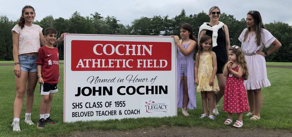 John Cochin's grandchildren are seen here at Sanford High School on July 14, 2023, moments after they unveiled the sign dedicating a baseball field to him.