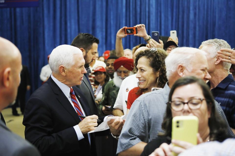 Vice President Mike Pence talks with supporters after speaking at a "Keep America Great" rally at the Venetian Event Center at St. Mark the Evangelist Catholic Church in Tampa, Fla., Thursday, Jan. 16, 2020. (Octavio Jones/Tampa Bay Times via AP)