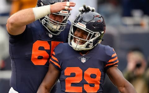 Chicago Bears running back Tarik Cohen (29) celebrates with Chicago Bears center Cody Whitehair (65) after scoring a touchdown in the first quarter against the New York Jets at Soldier Field - Credit: USA TODAY