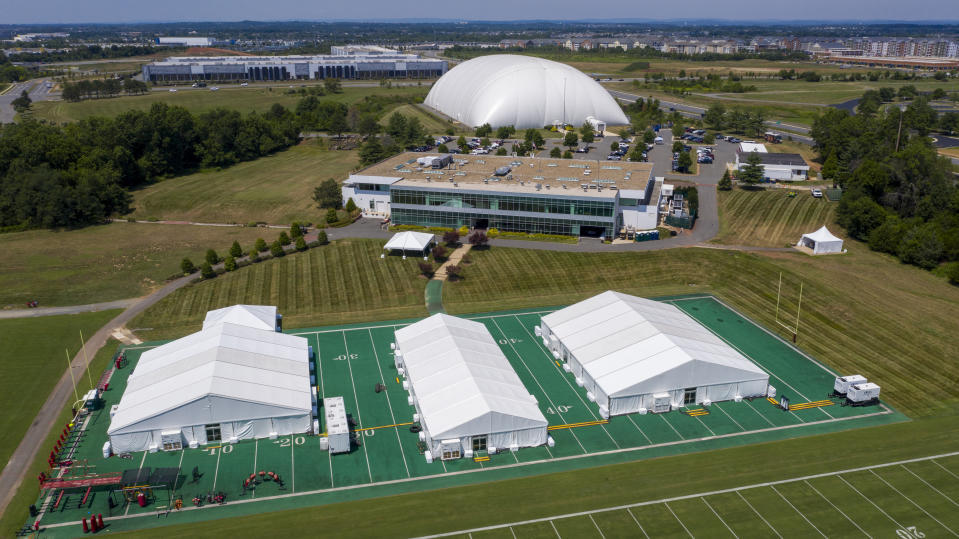 This aerial image shows the Washington NFL football teams training facility which includes large tents and a domed facility Thursday July 30, 2020, in Ashburn, Va. NFL football training camps will look different this year than it has in years past. Coronavirus health precautions has caused a lot of changes to NFL protocol ahead of the 2020 season. (AP Photo/Steve Helber)