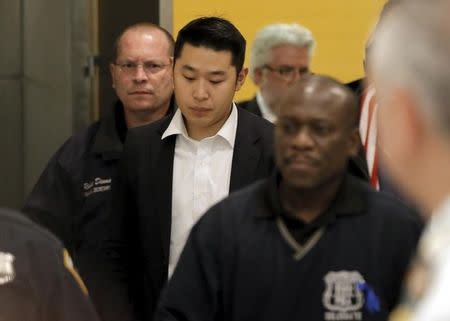 New York City Police officer (NYPD) Peter Liang is led from the court room at the Brooklyn Supreme court in the Brooklyn borough of New York February 11, 2016. REUTERS/Brendan McDermid