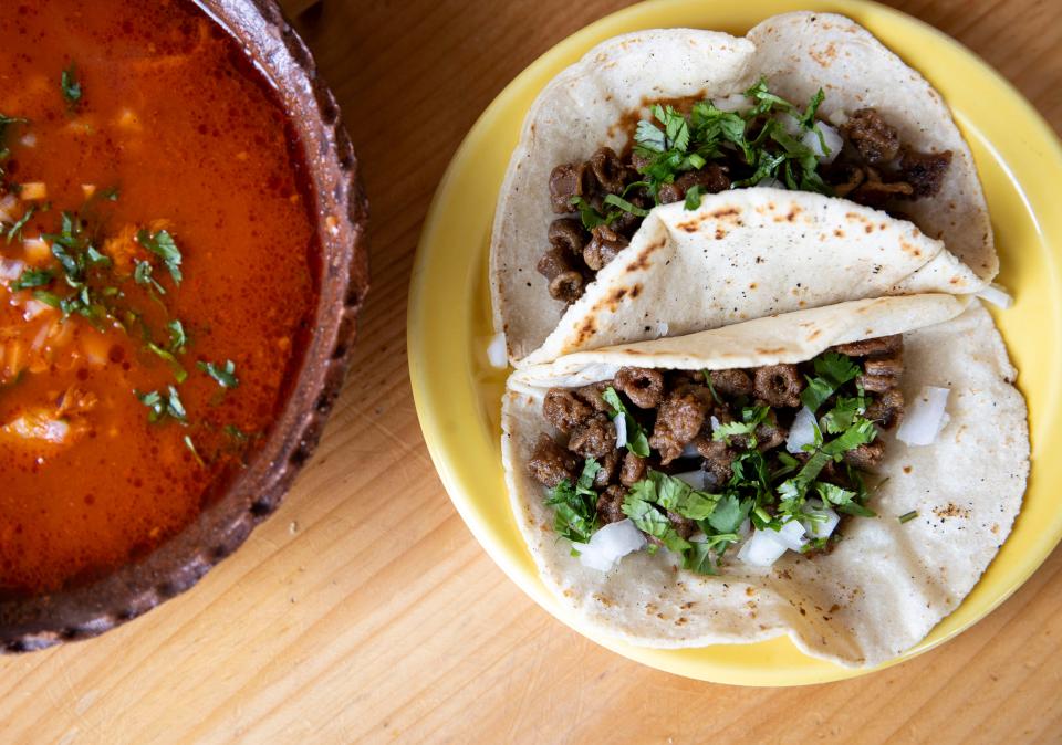 Tripa tacos are served alongside menudo at La Cazuela Mexican Restaurant on Friday, March 29, 2024 in Independence, Ore.