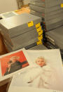 Two photos of Marylin Monroe by the late celebrity photographer Milton H. Greene are seen among boxes containing more pictures, in Warsaw, Poland. (AP Photo/Alik Keplicz)