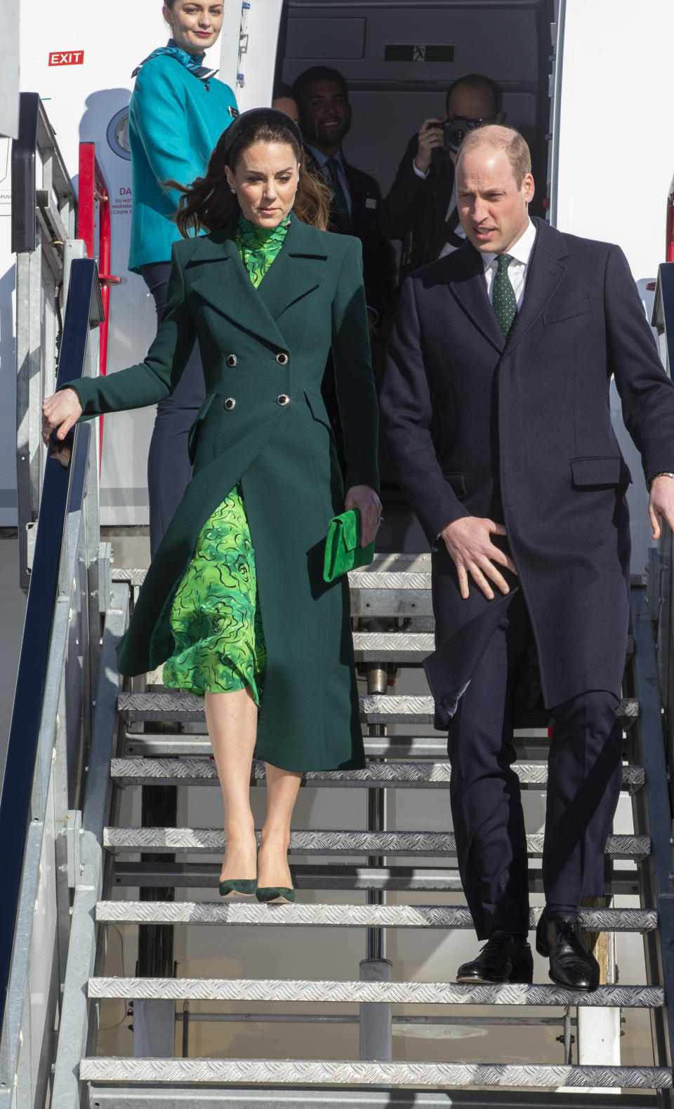 The Duke and Duchess of Cambridge walks down the steps of the plane as they arrive at Dublin International Airport ahead of their three day visit to the Republic of Ireland.