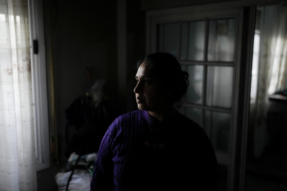 Gimena Páez poses for a photo at her home where she lives with her daughter in Buenos Aires, Argentina, Thursday, May 11, 2023. Páez, the mother of an 11-year-old girl, told The Associated Press that she has had to cut many products from her diet because her limited income is not enough and she is prioritizing always her daughter's portion. (AP Photo/Natacha Pisarenko)