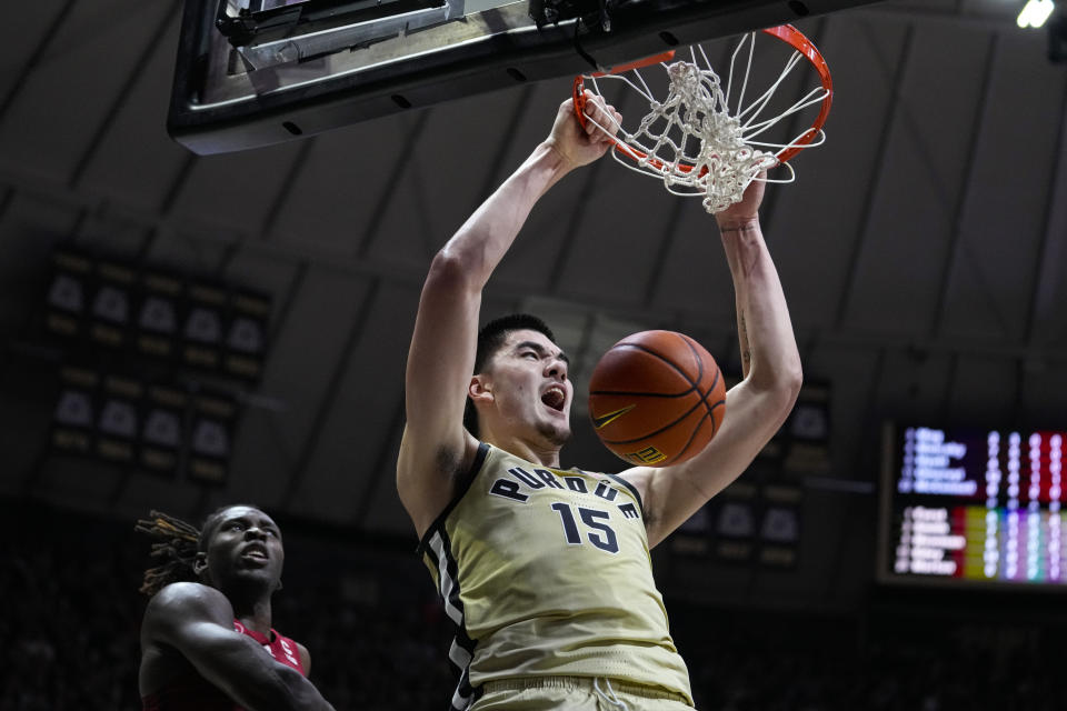 FILE - Purdue center Zach Edey (15) gets a dunk in front of Rutgers center Clifford Omoruyi (11) during the second half of an NCAA college basketball game in West Lafayette, Ind., Monday, Jan. 2, 2023. Edey was honored Friday, March 31, 2023, as The Associated Press men's college basketball Player of the Year. (AP Photo/Michael Conroy, File)