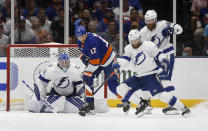 Tampa Bay Lightning goaltender Andrei Vasilevskiy (88) looks for the puck as teammates right wing Barclay Goodrow (19) and defenseman David Savard (58) defend against New York Islanders left wing Matt Martin (17) during the first period of Game 4 of an NHL hockey Stanley Cup semifinal, Saturday, June 19, 2021, in Uniondale, N.Y. (AP Photo/Jim McIsaac)