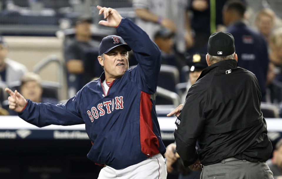 Boston Red Sox manager John Farrell gestures after was was ejected from the game by first base umpire Bob Davidson after Farrell objected to MLB's ruling of an overturned, fourth-inning, force out at first base in a baseball game against the New York Yankees at Yankee Stadium in New York, Sunday, April 13, 2014. The Yankees Brian McCann scored on the play. (AP Photo/Kathy Willens)