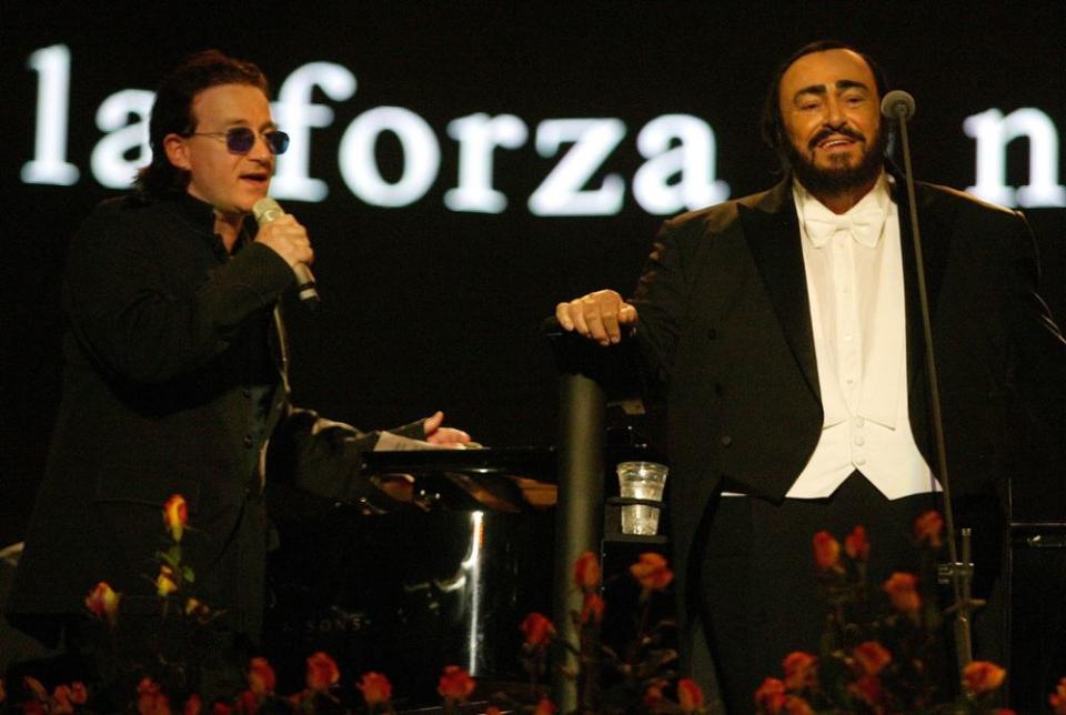 Bono and Luciano Pavarotti | Giuseppe Cacace/Getty Images)