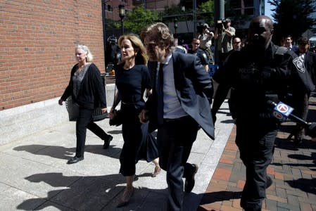 Actress Felicity Huffman and husband William H. Macy arrive at the federal courthouse in Boston