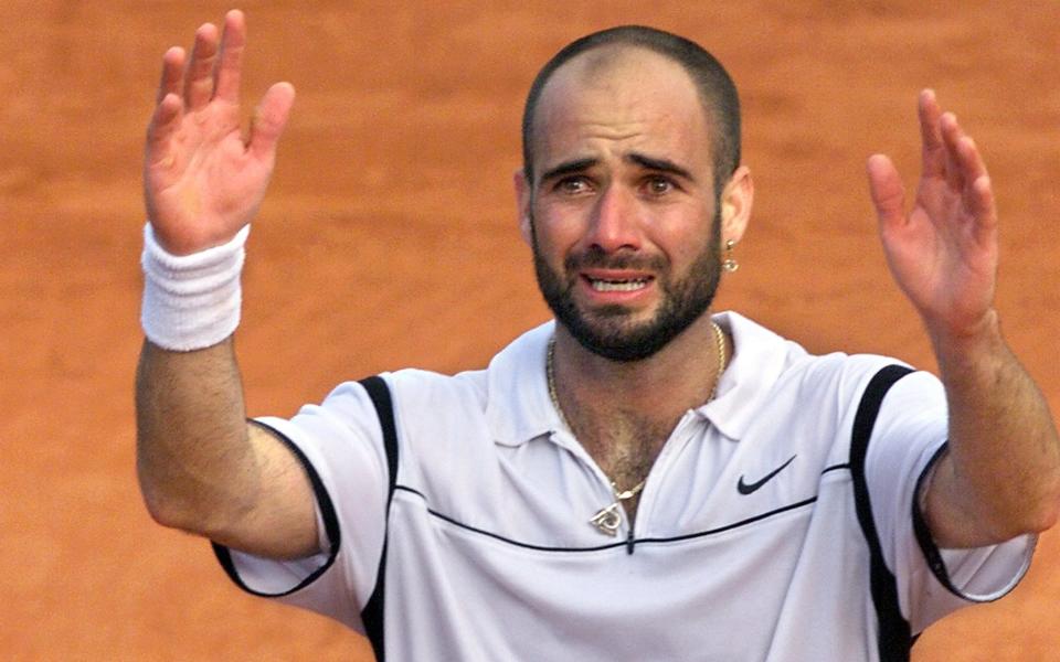 Andre Agassi reacts to winning the French Open in 1999 - AFP