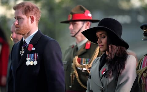 The couple, who are getting married next month, listen during the service - Credit: TOBY MELVILLE /Reuters