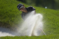 Aditi Ashok, of India, hits out of a bunker on the second green for an eagle during the final round of the LPGA Cognizant Founders Cup golf tournament, Sunday, May 14, 2023, in Clifton, N.J. (AP Photo/Seth Wenig)