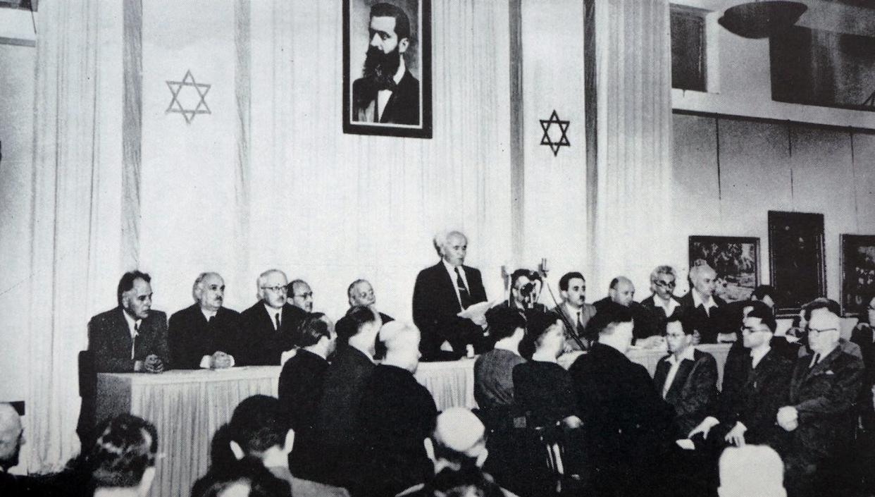 Under a portrait of Theodor Herzl, David Ben-Gurion on May 14, 1948, declares the establishment of a Jewish state to be known as the state of Israel. <a href="https://www.gettyimages.com/detail/news-photo/the-israeli-declaration-of-independence-proclaimed-on-14-news-photo/944222584?adppopup=true" rel="nofollow noopener" target="_blank" data-ylk="slk:Universal History Archive/Universal Images Group via Getty Images;elm:context_link;itc:0;sec:content-canvas" class="link ">Universal History Archive/Universal Images Group via Getty Images</a>