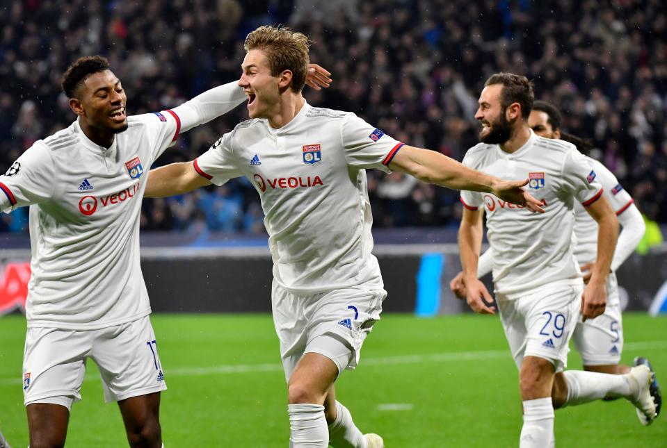 Lyon's Danish defender Joachim Andersen (C) celebrates after scoring his team's first goal during the UEFA Champions League Group G football match between Olympique Lyonnais and SL Benfica at the Decines Groupama Stadium, on November 5, 2019. (Photo by Philippe DESMAZES / AFP) (Photo by PHILIPPE DESMAZES/AFP via Getty Images)