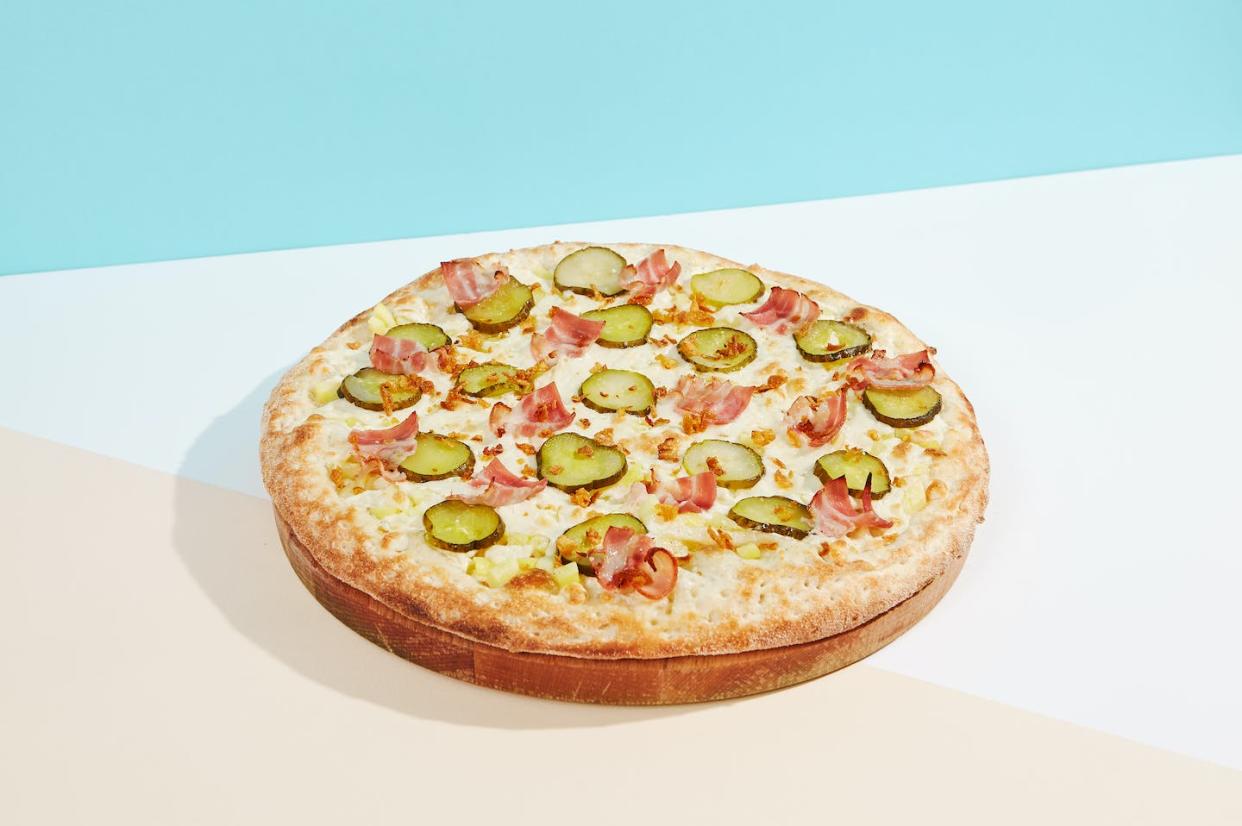 Hopefully, the pepperoni won't get too jealous over its disc-shaped competitor's moment in the sun. <a href="https://www.gettyimages.com/detail/photo/italian-pizza-with-bacon-pickled-cucumber-and-royalty-free-image/1409506296?adppopup=true" rel="nofollow noopener" target="_blank" data-ylk="slk:Ryzhkov/iStock via Getty Images Plus;elm:context_link;itc:0;sec:content-canvas" class="link ">Ryzhkov/iStock via Getty Images Plus</a>