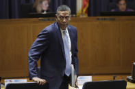 Michael Lewis, Pacific Gas and Electric Company (PG&E) Senior Vice President, Electric Operations walks to his seat after speaking during a California Public Utilities Commission meeting in San Francisco, Friday, Oct. 18, 2019. (AP Photo/Jeff Chiu)