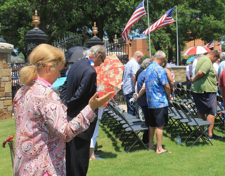 Prayer was part of the Memorial Day ceremony Sunday, May 29, 2022 at Fort Smith National Cemetery