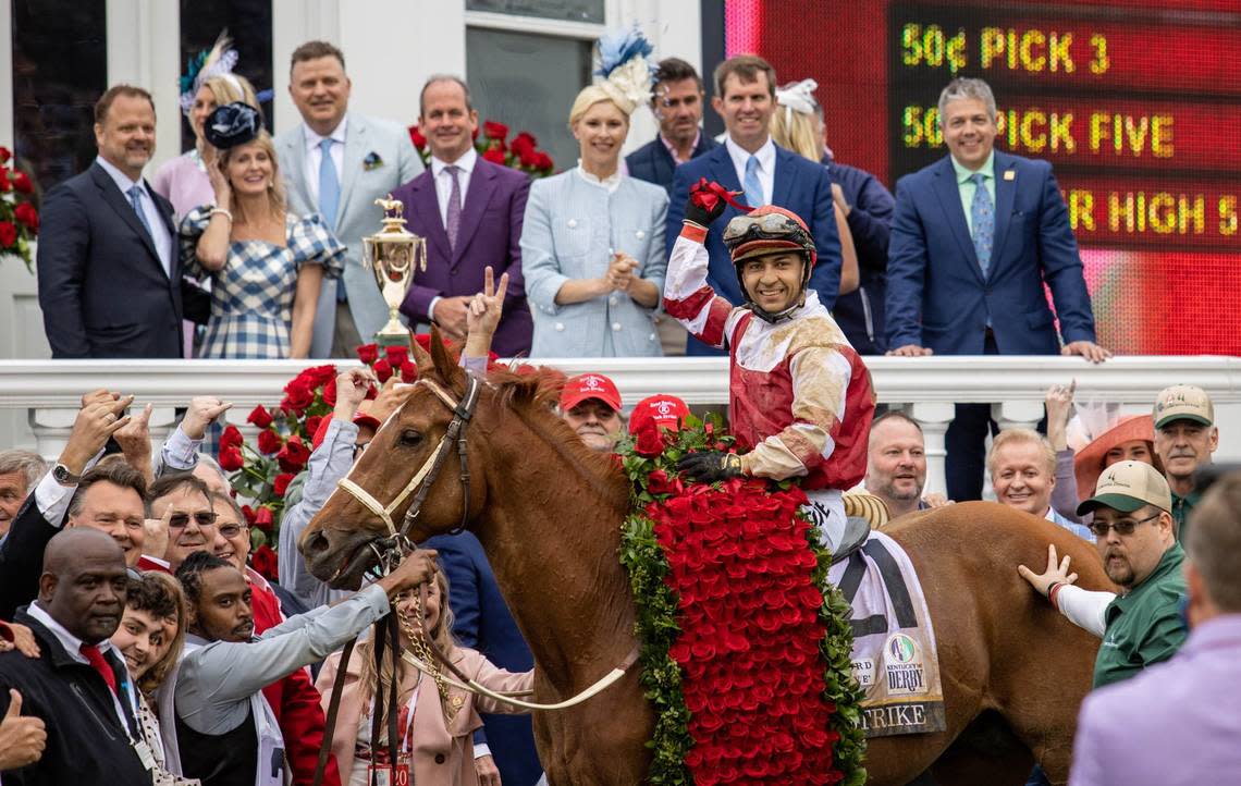 Jockey Sonny Leon and Rich Strike pause for a photo with friends, family and supporters after winning the 148th running of the Kentucky Derby at Churchill Downs.