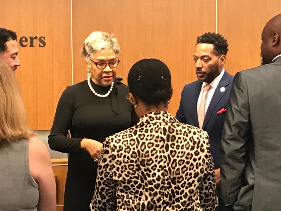 U.S. Rep. Joyce Beatty, left, talks with supporters Tuesday after the Franklin County Board of Commissioners approved $330,766 in  federal funds for the Otto Beatty Jr. Men's Shop.