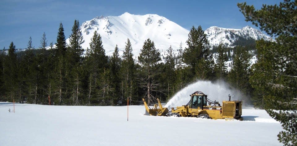 A snow plow clears the road by the Devastated Area in Lassen Volcanic Park during the spring of 2023.