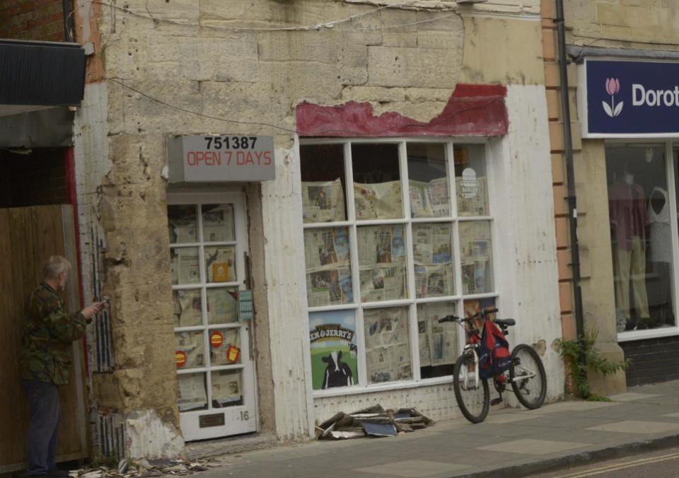 Wiltshire Times: A workman was pictured chipping orange paintwork from ther facade of the building back in September. Photo: Trevor Porter 70194-3 