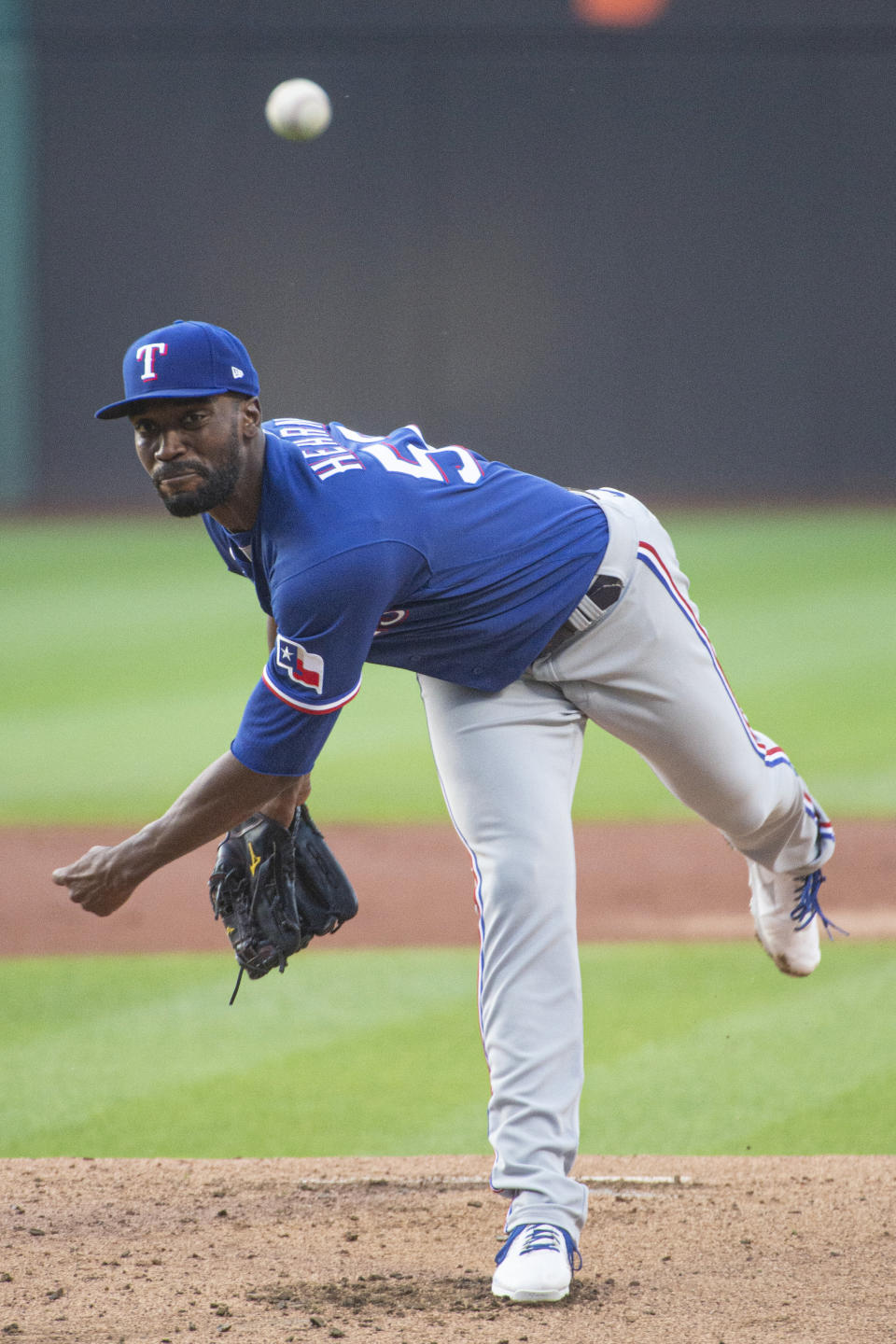 Texas Rangers starting pitcher Taylor Hearn delivers against the Cleveland Guardians during the first inning of the second game of a baseball doubleheader in Cleveland, Tuesday, June 7, 2022. (AP Photo/Phil Long)