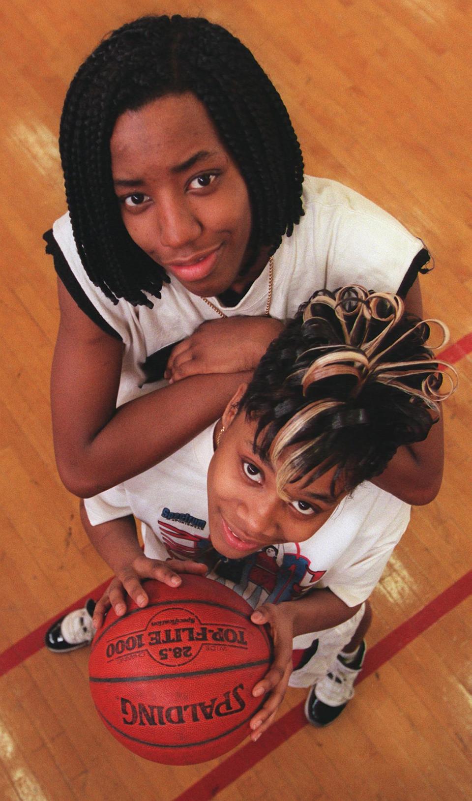 Bettina Love (top) with Edison Tech High School basketball teammate Tanesha James in 1996.