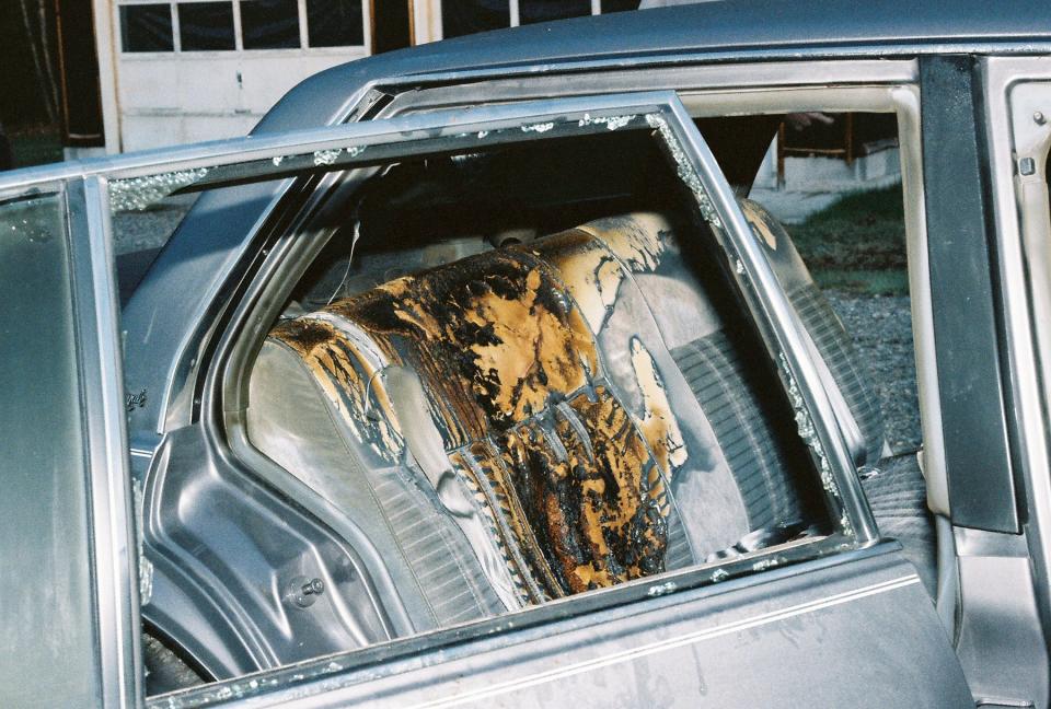 Look closely, and you can see Karen's soot-covered glasses resting on the back ledge of her burned Oldsmobile Delta '88 Royale.