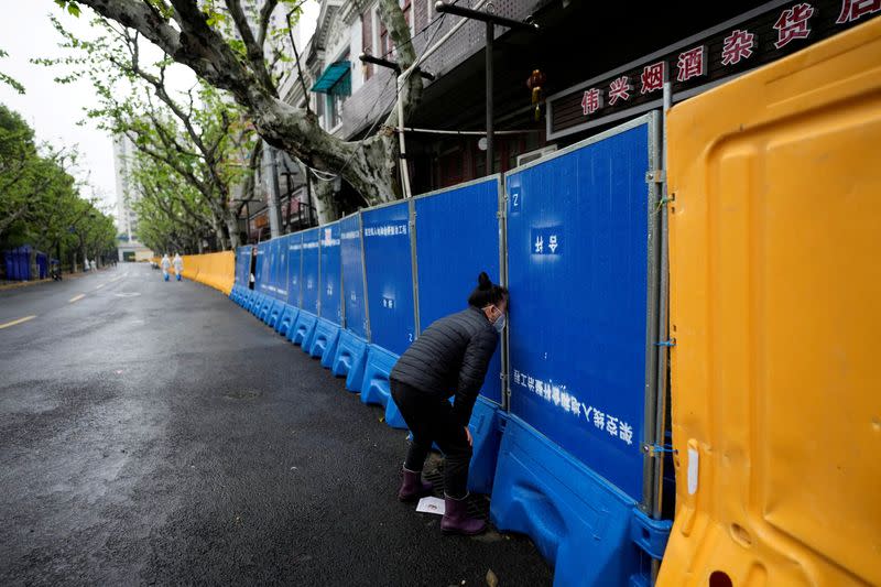 FILE PHOTO: 'How did we catch it?': spread of COVID baffles locked-down Shanghai residents
