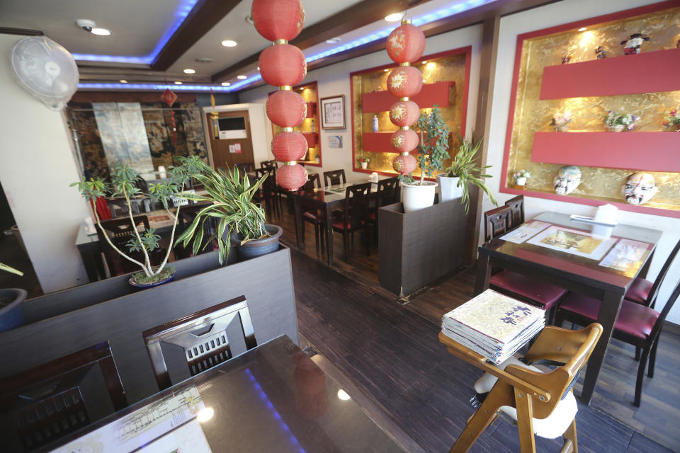 In this Feb. 14, 2020, photo, an empty Chinese restaurant is seen at the Chinatown in Incheon, South Korea. Even as cases and deaths from the new virus mount, fear is advancing like a tsunami - and not just in the areas surrounding the Chinese city of Wuhan, the center of the outbreak that has been declared a global health emergency. A restaurant owner in the Chinatown says visitors have dropped by 90%. (AP Photo/Ahn Young-joon)