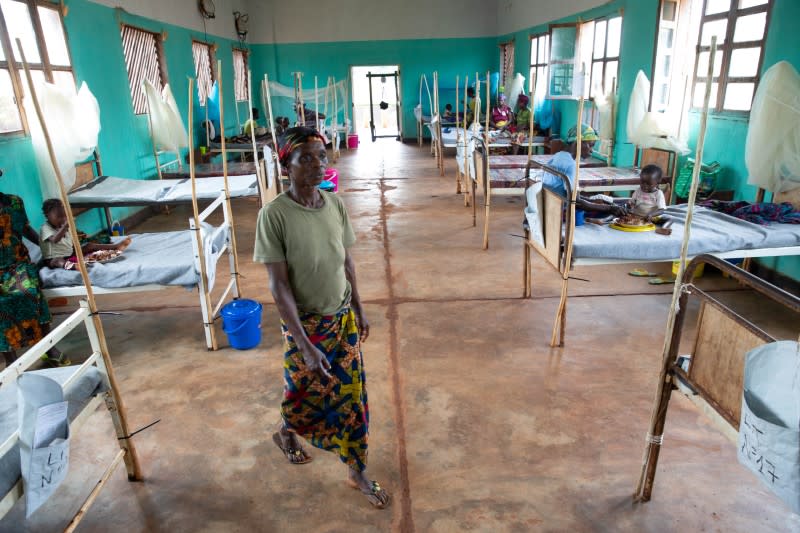 Wanea Mabele, mother of a measles patient, walks through the measles isolation ward in Boso-Manzi hospital in Mongala province